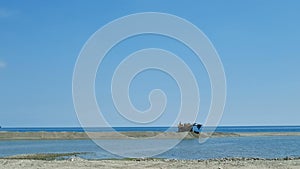 Mechanic scraper working on sea coast eart moving dredging against sand erosion problem