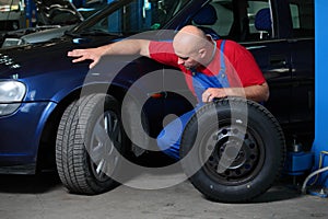 Mechanic servicing a car