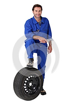 Mechanic with a spare tyre