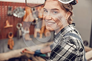 Mechanic standing in front of car tools