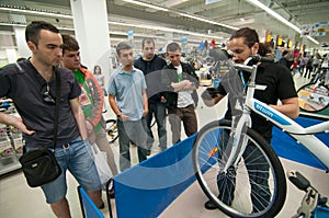 Mechanic teaching people how to repair a bicycle