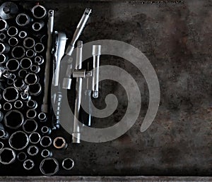 Mechanic tools set on metal background. Vintage style image of blank space on metal, lot of old tools. Copy space. Car service and