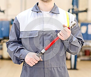 Mechanic with torque wrench.