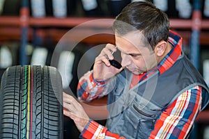 mechanic in uniform with phone