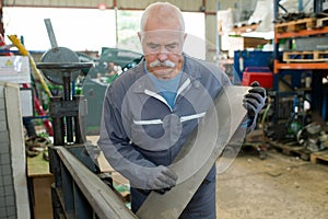 Mechanic using industrial lathe machine
