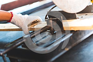 The mechanic is using wood cutting tools in construction