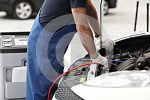Mechanic work in automobile shop, repair climate on car