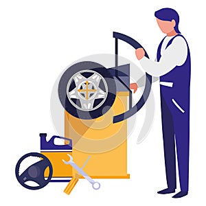 Mechanic worker with tire changer machine