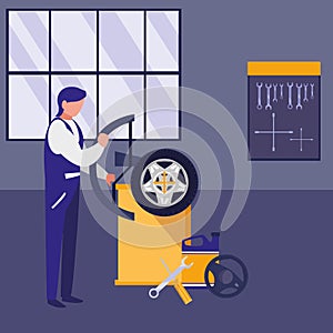 Mechanic worker with tire changer machine