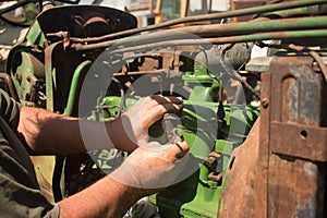 Mechanic working on Antique Tractor