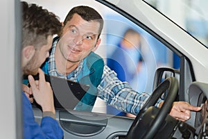 mechanic working on car enginee