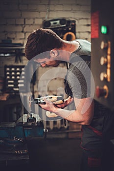 Mechanic working in car repair workshop