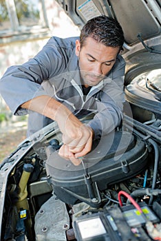 mechanic working on engine