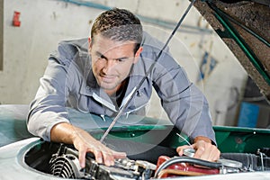 Mechanic working in engine bay