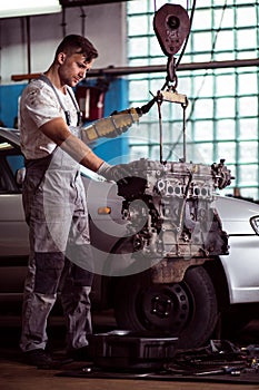 Mechanic working with engine