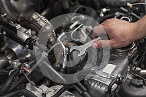 Mechanic working on engine repairs