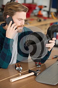 mechanic in workshop ordering parts