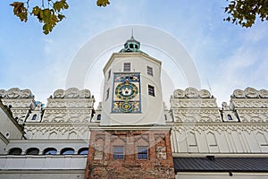 Mechanical clock and facade of the Ducal Castle in Szczecin, Poland, former seat of the dukes of Pomerania-Stettin, blue sky with