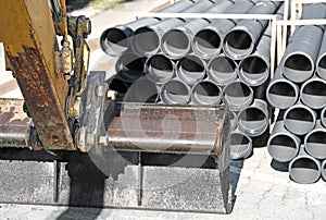 Mechanical Digger arm with bucket and laying of optical fibre co