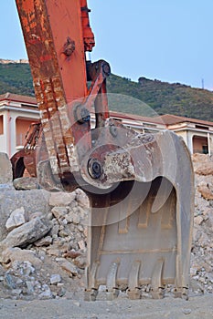 A mechanical diggers arm and bucket photo