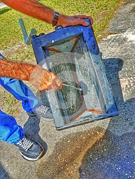 Mechanical engineer cleans the coils of an air handler