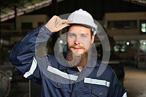 Mechanical engineer repairing engine machine at factory