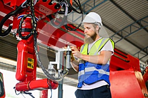 Mechanical engineer repairing engine machine at factory