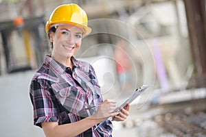 mechanical engineer taking notes at metallurgy factory