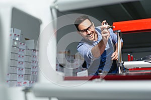 Mechanical engineer working on machines.