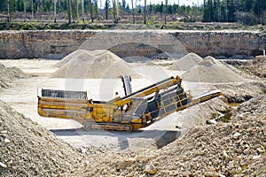 Mechanical machine, conveyor belt for transporting and crushing stone with sand. Mining quarry for the production of crushed stone