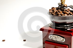 Mechanical manual retro coffee grinder. On a light background. Close-up