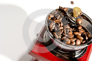 Mechanical manual retro coffee grinder. On a light background. Close-up