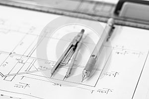 Mechanical pencil and divider on technical drawing