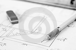 Mechanical pencil and eraser on technical drawing