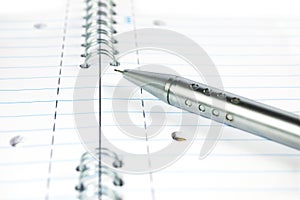 Mechanical pencil on a notepad