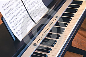 Mechanical piano keys with notes and a delicate, beautiful background