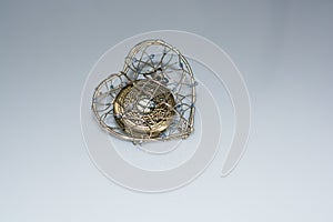 Mechanical pocket watch in a heart cage