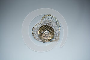 Mechanical pocket watch in a heart cage