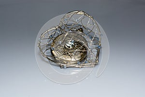 Mechanical pocket watch in a heart cage