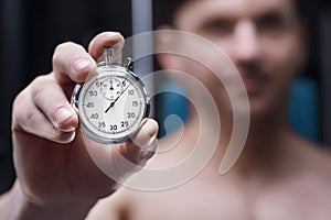 Mechanical stopwatch in a hand