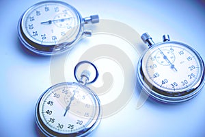 Mechanical stopwatch on a white and blue background