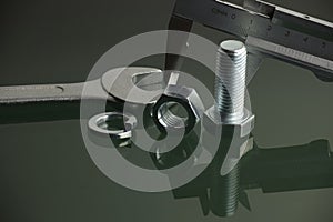 Mechanical tools and fasteners on reflective surface