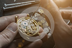 Mechanical watch repair. Watchmaker is repairing the mechanical watches