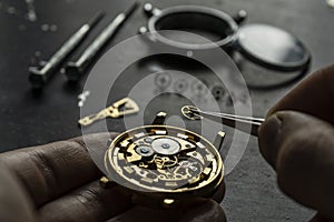 Mechanical watch repair. Watchmaker is repairing the mechanical watches