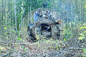 Mechanically driven drill in forest