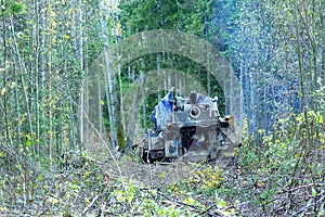 Mechanically driven drill in forest photo