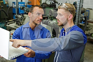 Mechanics looking at computer