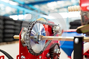 Mechanism gear with chain transmission. Chain and cogwheel in agricultural machine. Fragment of precision seeders photo