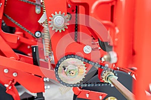 Mechanism gear with chain transmission. Chain and cogwheel in agricultural machine. A fragment of a precision seeders. photo