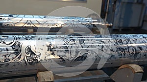 The mechanism of printing on wallpaper. Modern printing press for wallpaper